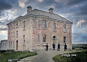 This is a beautifully restored 1900's image of the Bishop's House in Armagh. Four clergymen pose at the front of the dwelling dressed in top hat and finery.